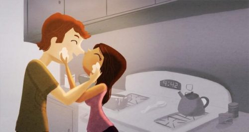 Chłopak z dziewczyną przytulają się na kuchni