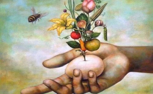 Jajko w dłoni, z którego rosną kwiaty