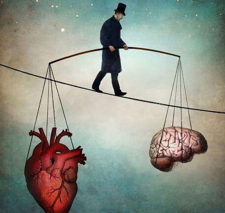 Mężczyzna balansujący na linie pomiędzy mózgiem a sercem.