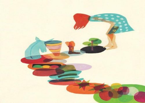 Kobieta pielęgnująca kolorowe kwiaty