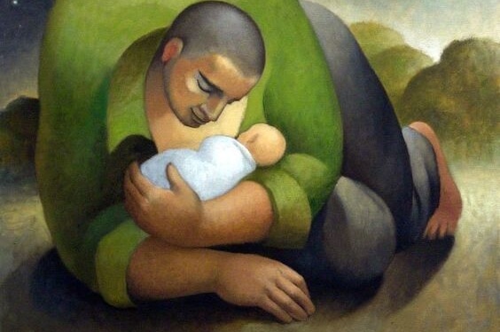 Ojciec trzyma w ramionach dziecko.