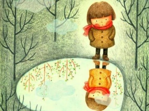 Dziecko patrzące na swoje odbicie w stawie