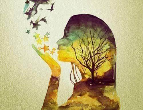 Dziewczyna zdmuchuje z dłoni gwiazdy