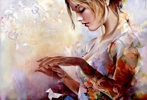 Dziewczyna z papierowym ptakiem na sznurkach