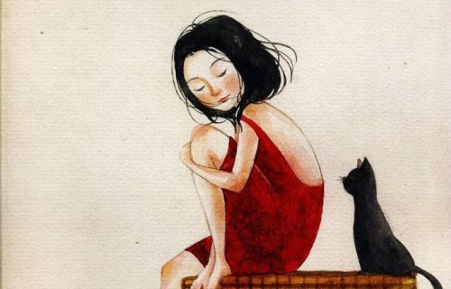Dziewczyna w czerwonej sukience i czarny kot