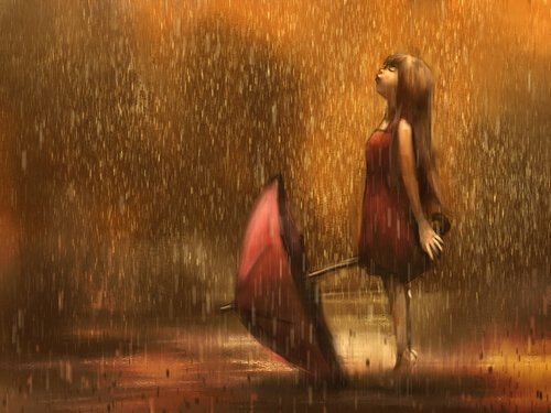 Dziewczynka z parasolem w deszczu.