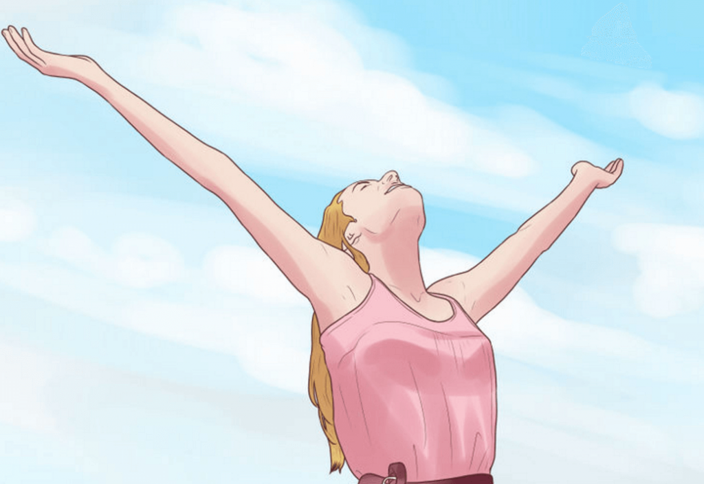 Szczęśliwa kobieta podnosi ręce ku niebu