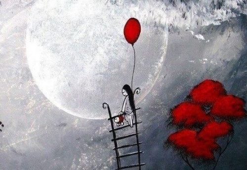 Kobieta na drabinie i czerwony balon