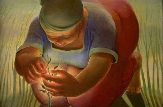 Kobieta opiekująca się roślinką.