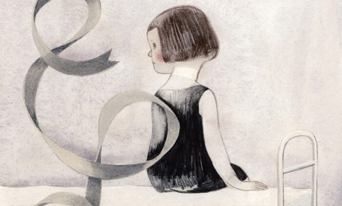 Dziewczynka siedzi na łóżku