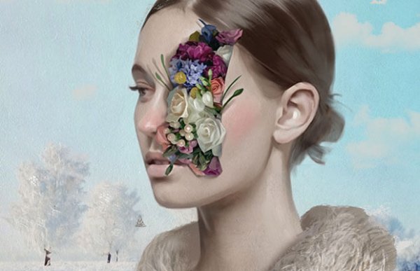 Dziewczyna i kwiaty na twarzy.