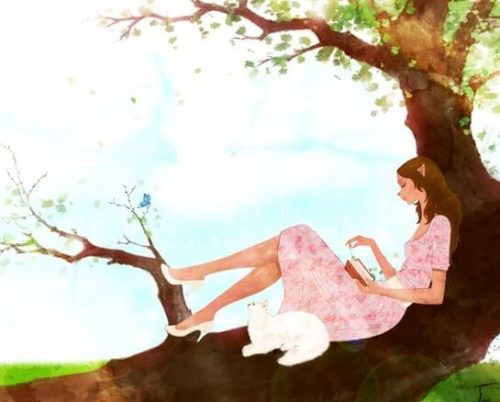 Kobieta siedząca na drzewie