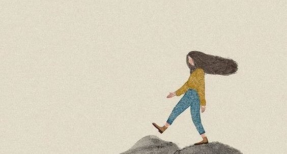 Dziewczynka idąca po skałach.