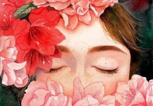 Dziewczyna z twarzą ukrytą wśród kwiatów