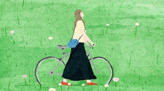 Kobieta z rowerem.
