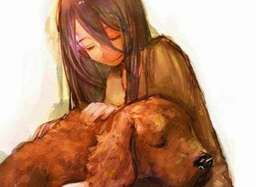 Dziewczynka trzyma zwierzę - psa
