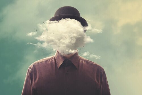 mężczyzna z głową w chmurach reprezentujący negatywne emocje